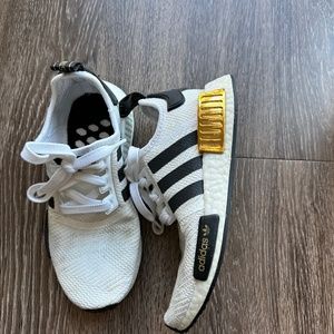Black, White, & Gold NMD Adidas sneakers